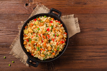 Fried Rice With Chicken. Prepared And Served In A Wok.