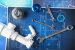 © Africa Studio - Plumber's items on blueprint