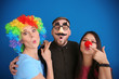 © Africa Studio - Young people in funny disguise posing on color background. April fool's day celebration