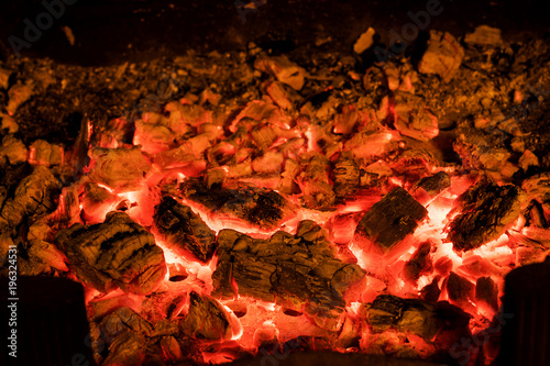 Fotografie, Obraz Photo of hot sparking live-coals burning in a barbecue.