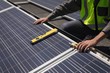 © Wavebreak Media - Male worker working on solar panels at solar station