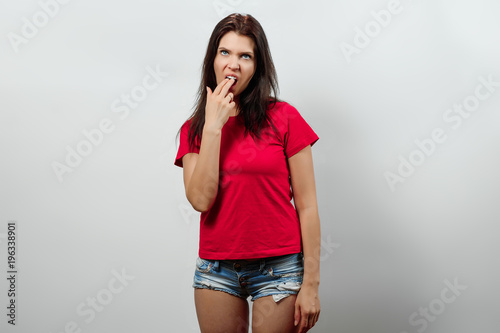 Fotografia, Obraz A young, beautiful girl shows a gesture that she is sick of everything