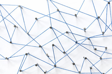 Poster - A large grid of pins connected with string. Communication, technology, network concept