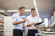 © Westend61 - Two businessmen in factory discussing product