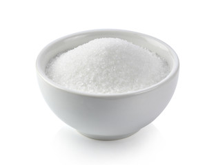 Wall Mural - white sugar in white bowl on white background