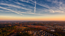 Contrails In Sunrise Sky Suburbia Durham North Carolina