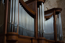 Horizontal View Of Close Up Of The Pipes Of A Pipe Organ In A Church. Bari, South Of Italy