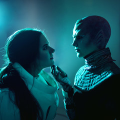 Wall Mural - Woman and an alien look at each other. Contact with other civilizations