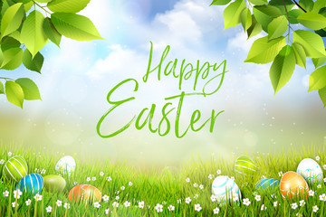 Wall Mural - Happy Easter greeting card concept, spring meadow with a beautiful background and lying Easter eggs in the grass