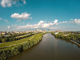 Fototapeta Miasta - Drone image over the white river in Indianapolis with skyline