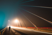 Long Exposure In Foggy Night On Iron Bridge