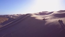 Dune Buggies And ATVs Race Across The Imperial Sand Dunes In California.