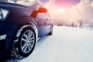 car at winte on the snowly road