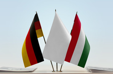 Wall Mural - Flags of Germany and Hungary with a white flag in the middle