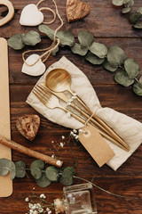 Wall Mural - Gold cutlery. Festive table set with rustic decor. Flat lay