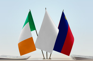 Flags of Ireland and Liechtenstein with a white flag in the middle