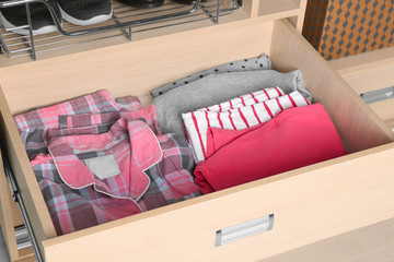 Wall Mural - Folded pajamas in drawer of wardrobe closet