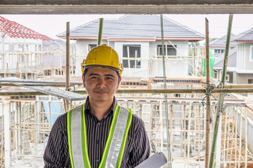 Asian business man construction engineer worker at house building site