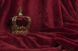 Royal crown on a red velvet background