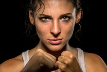 Intense Female Fighter Stare With Fist Up In Self Defense Training, Powerful And Confident