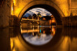 The dome of Saint Peter's Basilica in Vatican, view through the arch of bridge, evening time
