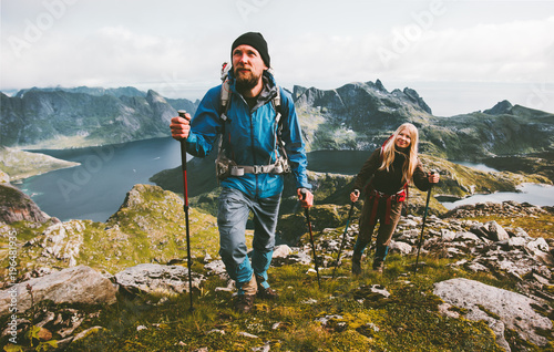 Cuadros en Lienzo Couple travelers hiking in mountains family traveling together adventure lifesty