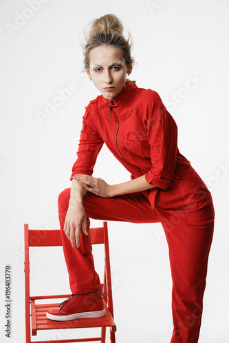 Fényképezés Provocative fashionable woman in red overall