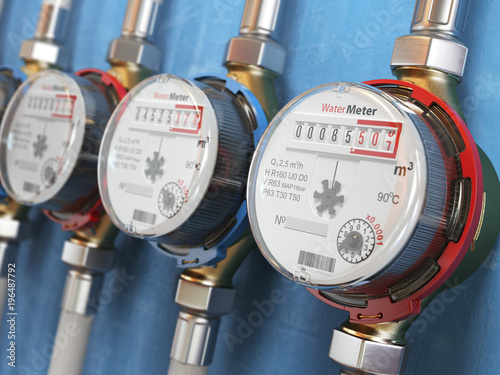 Cuadros en Lienzo Row of water meters of cold and hot water on the wall background.