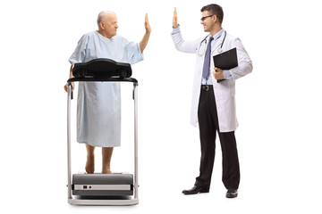 Poster - Elderly patient walking on a treadmill and high-fiving a doctor