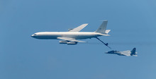 Israeli Fighter Jet And Tanker In Air Refueling. The Jets Flight From Right To Left In Formation.