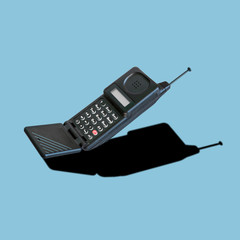 vintage analog cellular phone with flip mouthpiece, dummy aerial and led display; it was innovative 