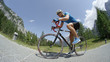 © helivideo - LOW ANGLE: Caucasian sportsman wearing sunglasses enduring a strenuous bike race