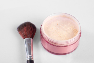 Cosmetic brush with makeup powder