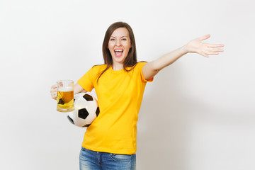 Wall Mural - Beautiful European young cheerful woman, football fan or player in yellow uniform holding pint mug of beer, soccer ball isolated on white background. Sport, play football, healthy lifestyle concept.