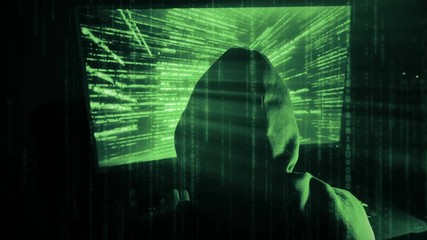 Poster - a man hacker in a hood in a dark room works with the program code