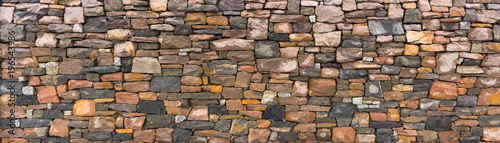 Fotografía Seamless stone masonry using rectangular stones, red and gray shades