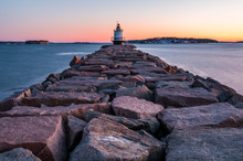 A Beautiful Sunrise Overlooking A Lighthouse In Maine. 
