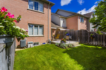 Wall Mural - Backyard garden of custom built luxury house in the suburbs of Toronto, Canada.