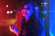 © morozov_photo - Sexy young woman posing over night city dramatic neon background