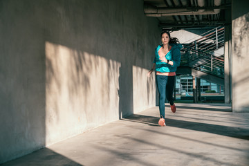 Wall Mural - Woman doing running exercise cardio outdoor.