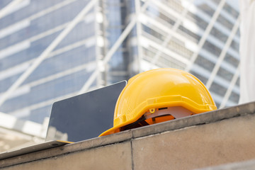 Safety hat with computer for construction or architect concept