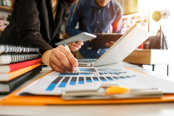 Working team meeting concept,businessman using smart phone and laptop and digital tablet computer in modern office with virtual interface icons network diagram at modern office in morning light
