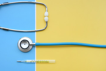 close up of stethoscope and thermometer for background