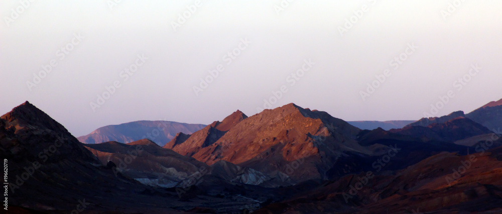 Mountains in the desert at sunrise sunset - obrazy, fototapety, plakaty 