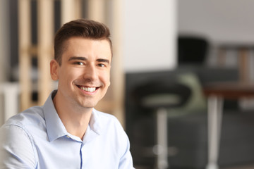 Canvas Print - Portrait of handsome young man in office