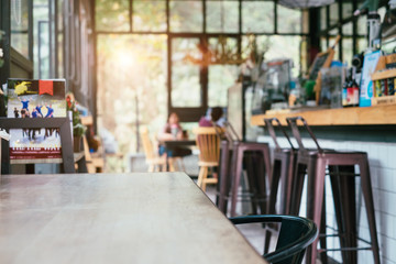 coffee shop and wooden table space in morning light