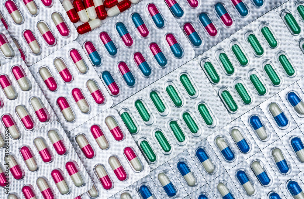 Full frame of antibiotic capsule pills in blister pack. Pharmaceutical ...