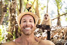 Men Tourist Makes Selfie Self Portrait With Monkey