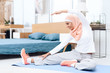 © freeograph - Arab woman doing gymnastics in the bedroom.