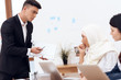 © freeograph - A man makes a claim to a woman wearing a hijab.
